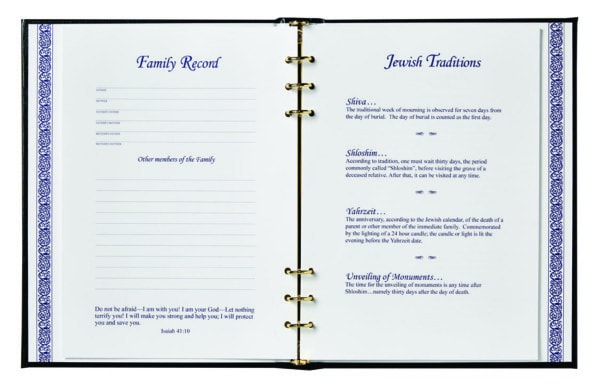 Opened book showing Family Record and Jewish Traditions pages