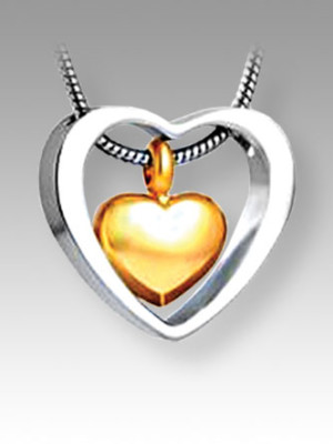 open silver heart with separate gold heart inside pendant